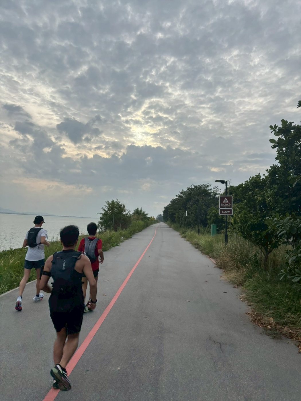 DJ TakeRun running with others, seen from behind